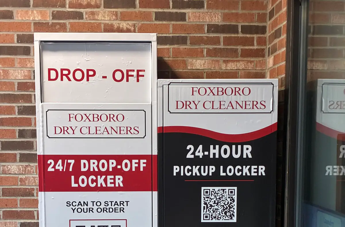 Foxboro Dry Cleaners outdoor 24-hour pickup and drop-off lockers with QR code signs